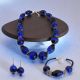 Ensemble composé d'un collier, d'un bracelet et de boucles d'oreilles, authentiques perles en verre de Murano soufflé.